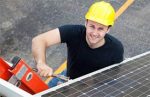 HVAC installer, smiling, on ladder